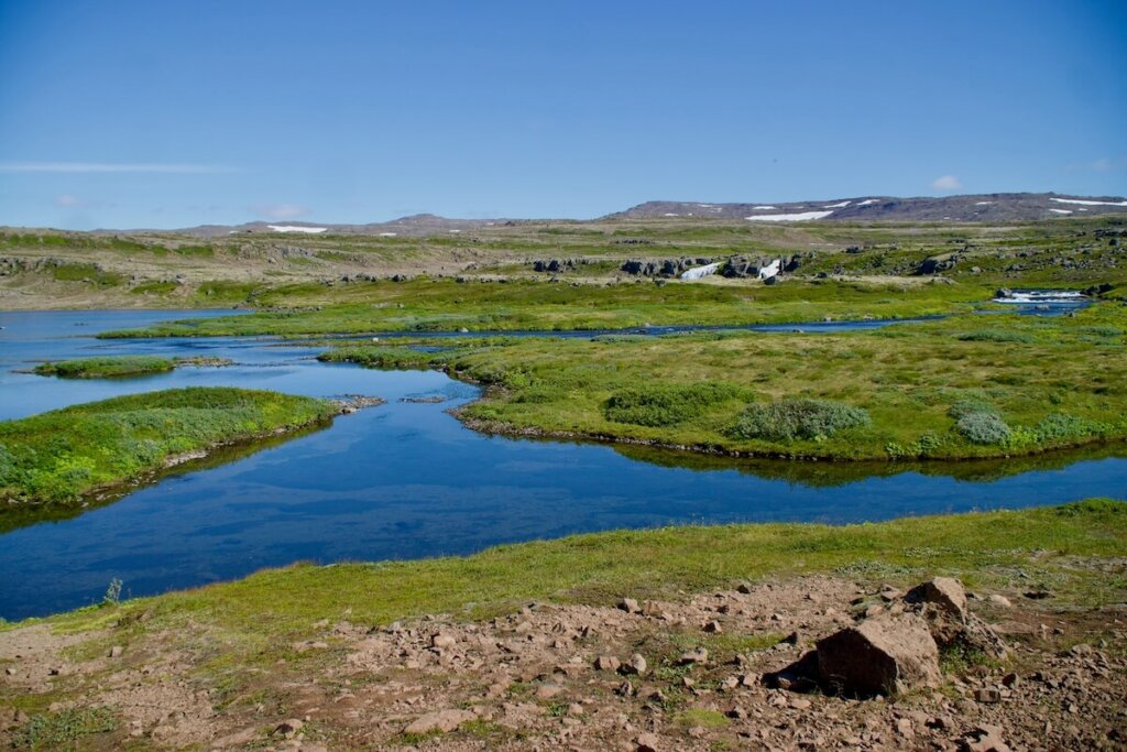 The westfjords region with its river and flat meadow area