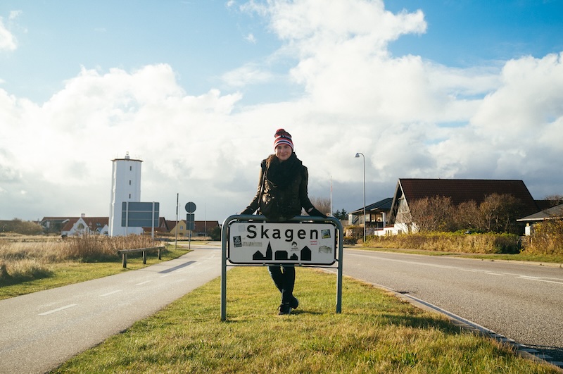 Allison Green standing in front of the sign for Skagen