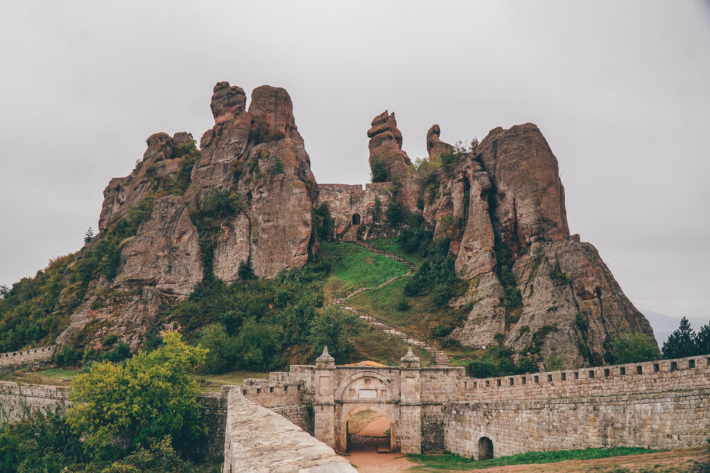 The rock pillars of Belogradchik fortress with a castle gate on a cloudy day
