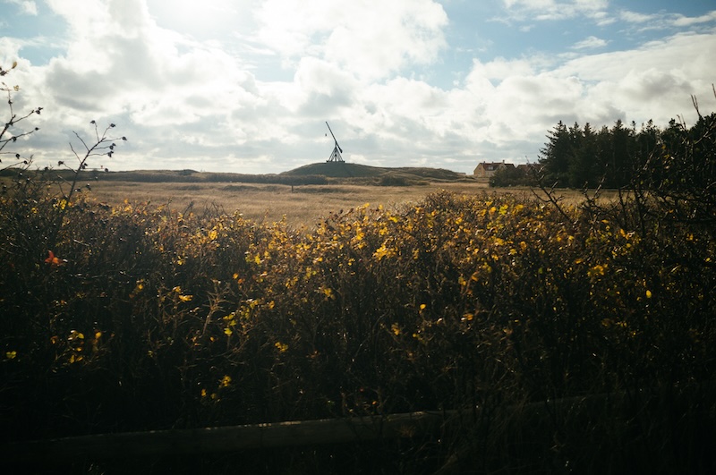 the old beacon as seen from afar close to sunset on a cold day