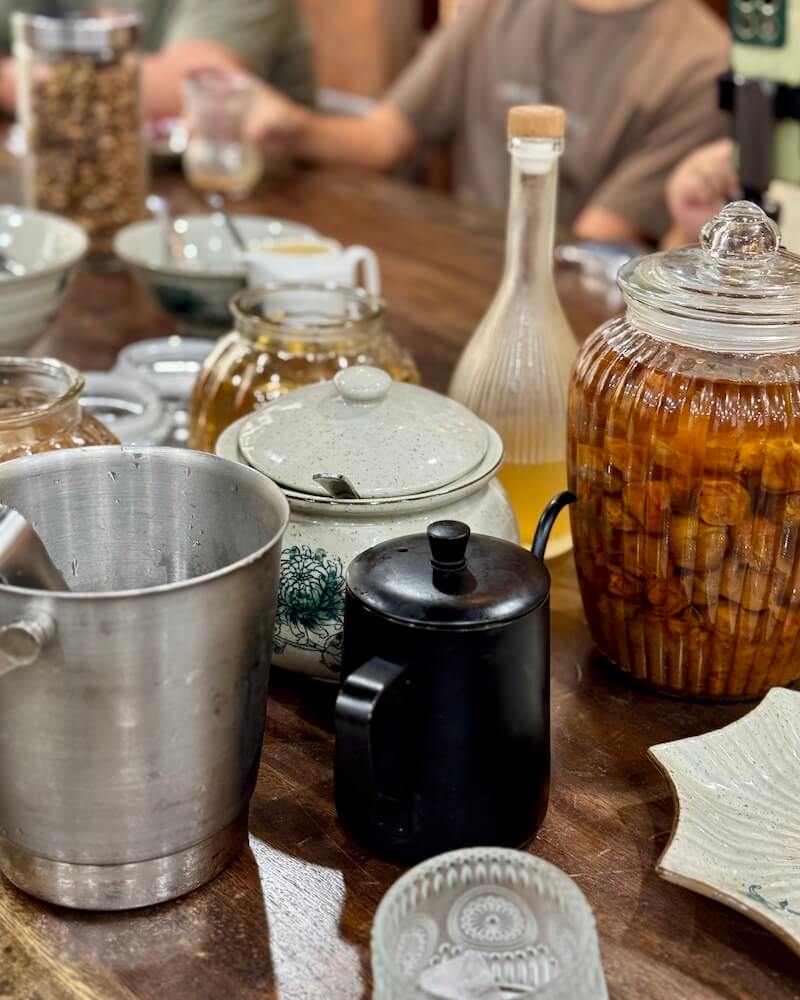 Ingredients for mocktails and cocktails including a homemade apricot wine for the alcoholic version