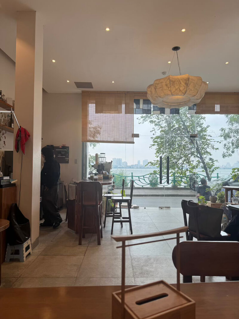 Looking out onto the lake from the interior of a hanoi cafe