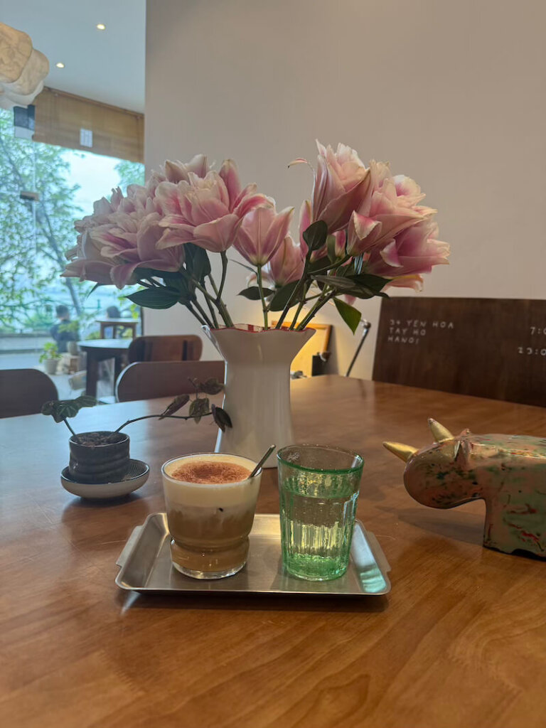 Flowers and coffee on the lake