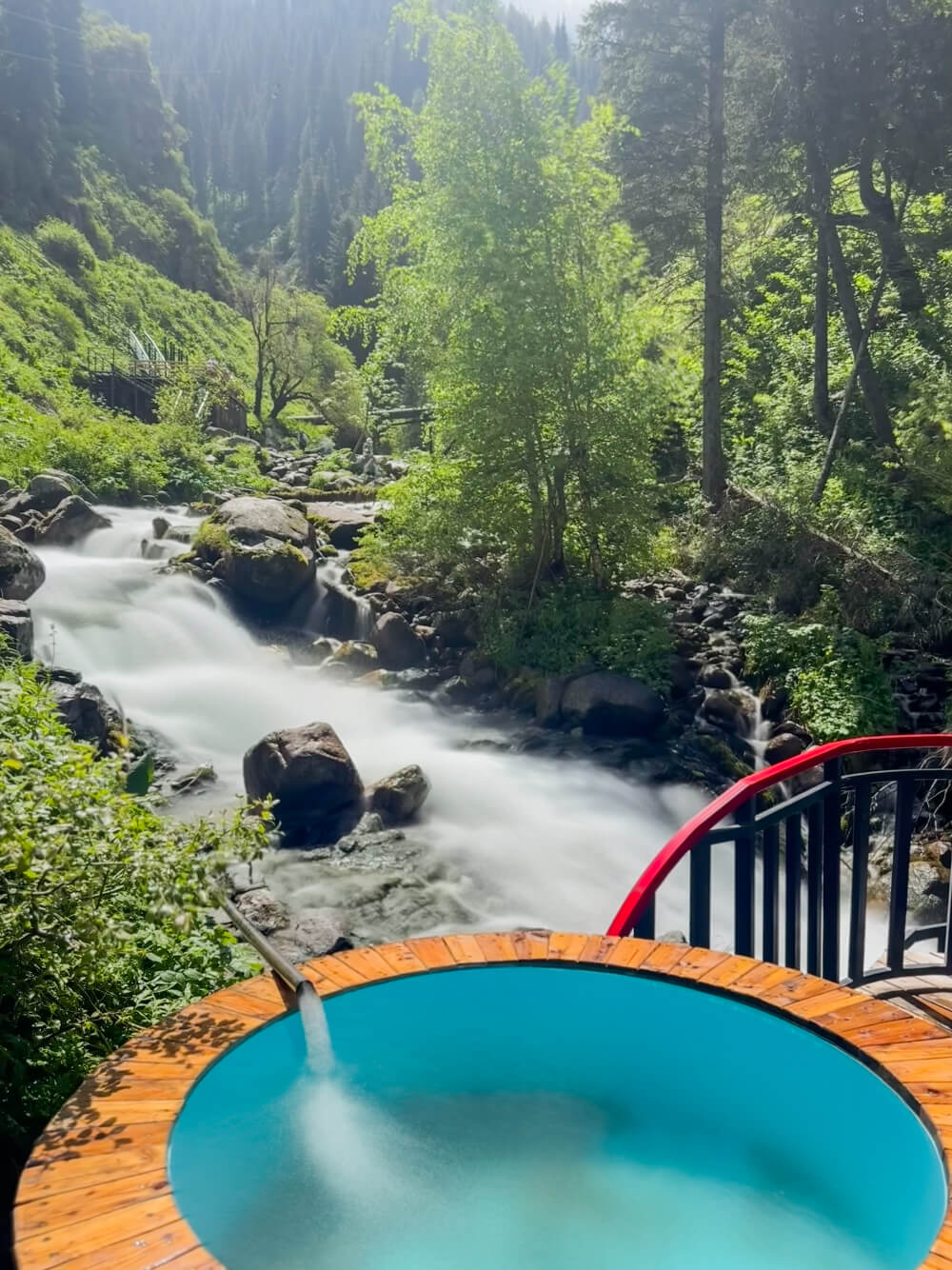 Cold pool with the river flowing and red railing