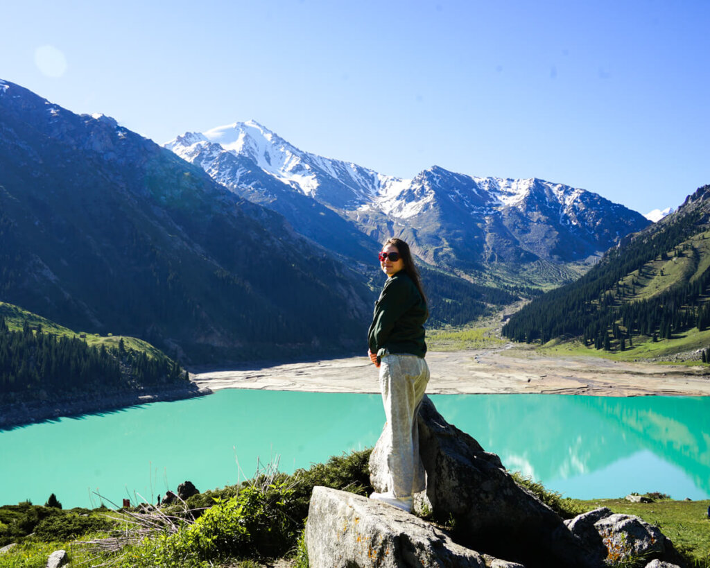 Allison Green standing on a rock near Big Almaty Lake