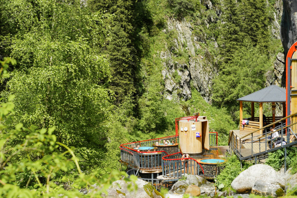 Natural hot springs near Almaty nestled in the forest near a river