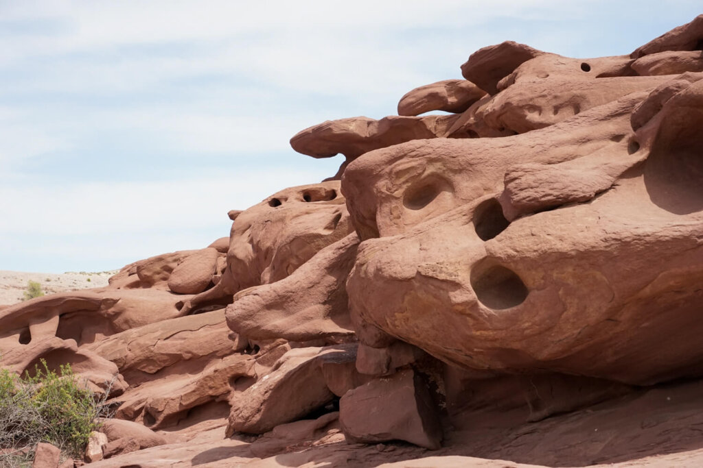 Close up view of the rock formation with holes in the rock