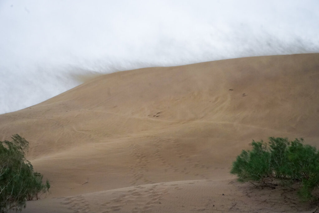 Crazy clouds of sand rising up and floating