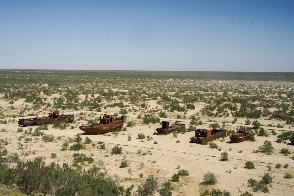 The ship graveyard with scrub brush and rusting rotting ships where the Aral Sea used to be