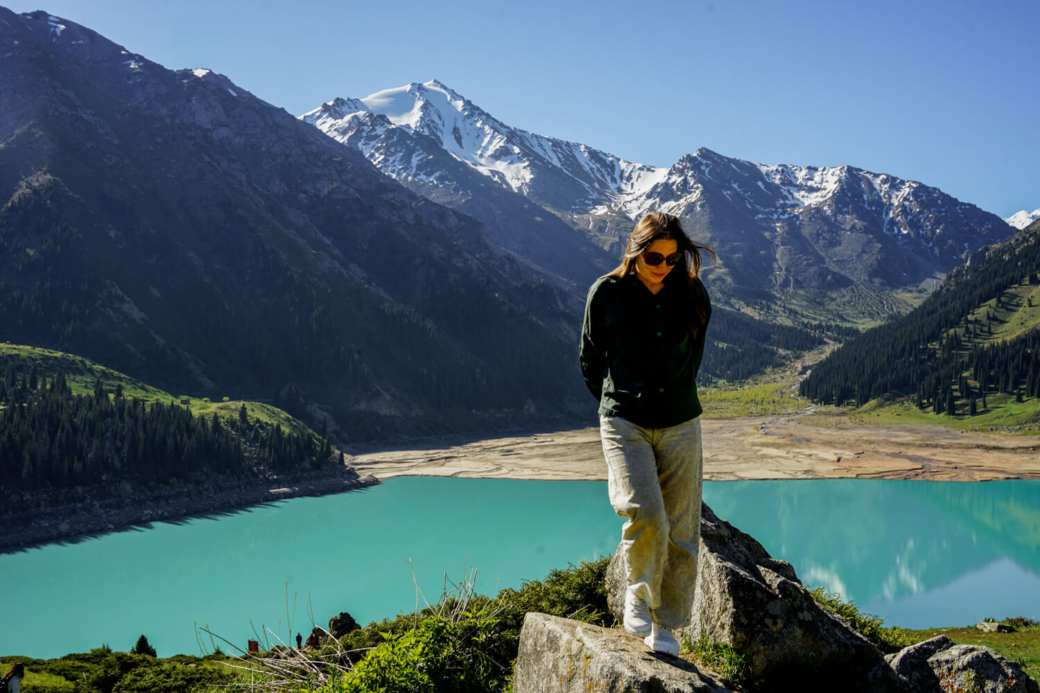 Allison Green, the author of the article, standing at Big Almaty Lake