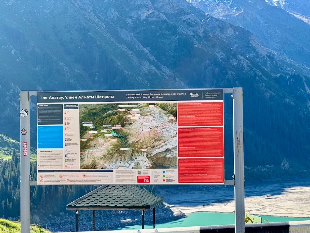 Big Almaty Lake in May with partial lake filled in at the top of the mountain