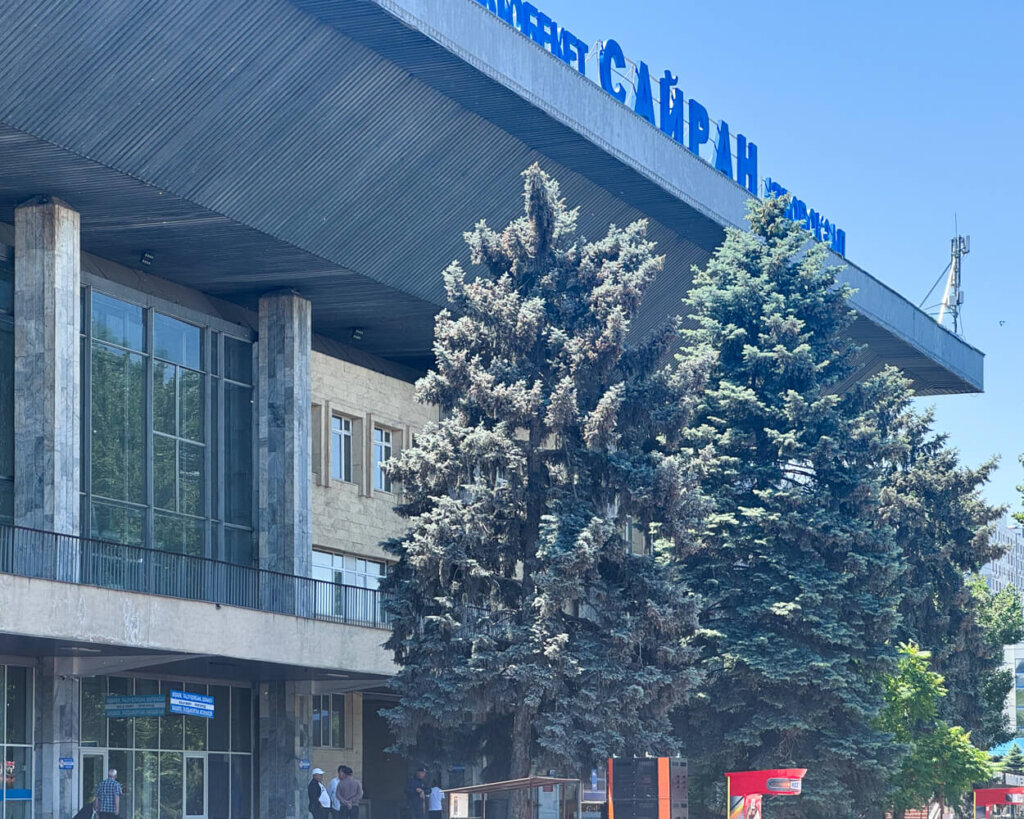 Sairan bus station in Almaty with signage