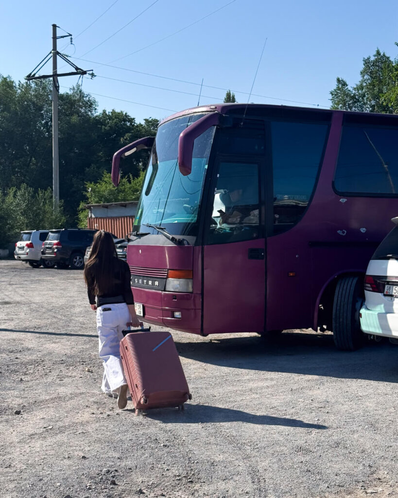 Our bus on the Kazakh side of the border crossing, waiting as described