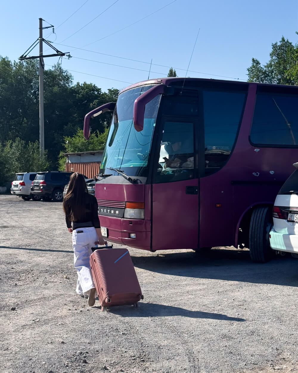 Our bus on the Kazakh side of the border crossing, waiting as described