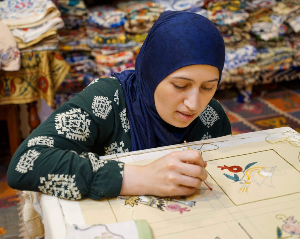 A master at work creating a suzani masterpiece