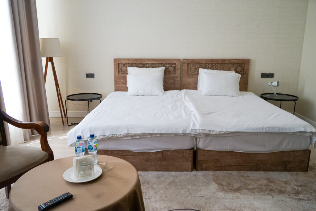 The very large bed at Jipek Joli Hotel with two duvets