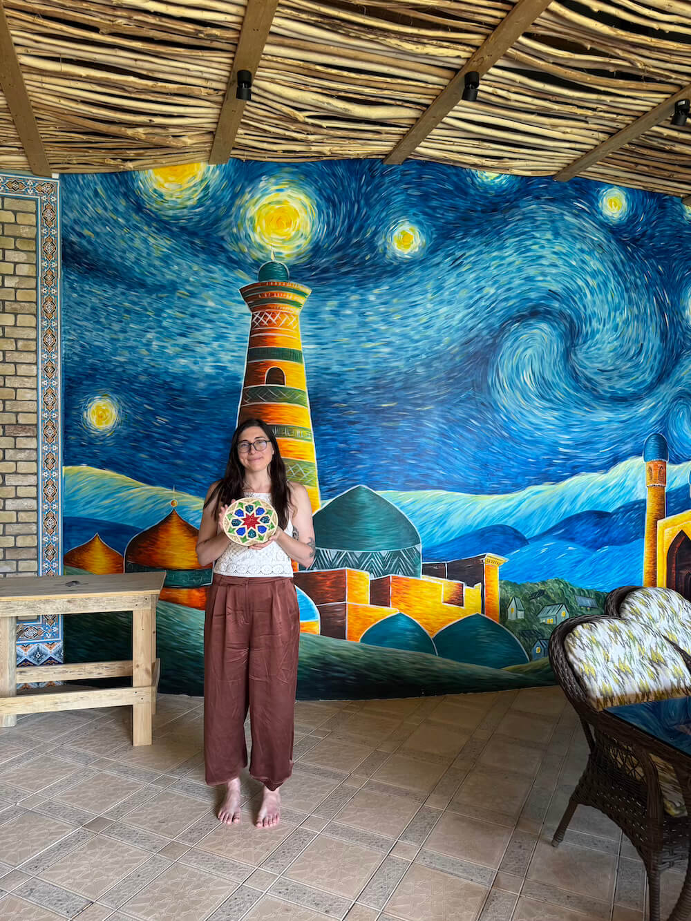 Allison Green author of the article with her completed piece of mosaic art