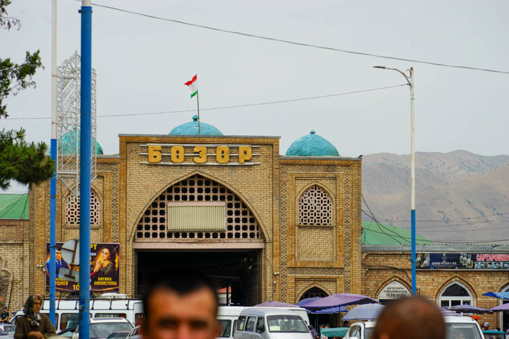 Bazaar in Tajikistan with mountains in the background